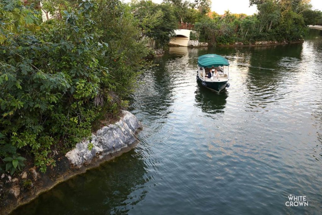 Just married couple taking a boat ride at Fairmont mayakoba resort