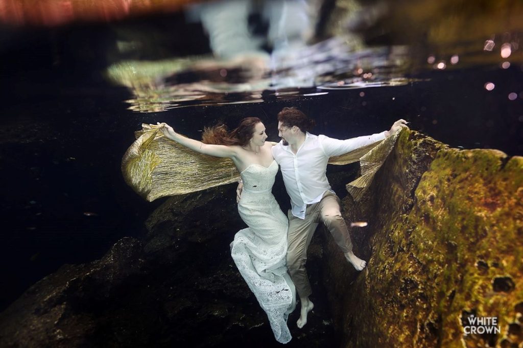 underwater trash the dress photo session in a cenote