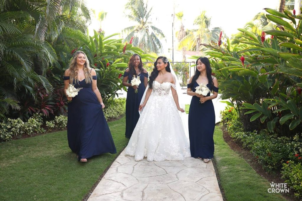 bride and bridesmaids' waiting in a garden minutes before the wedding ceremony