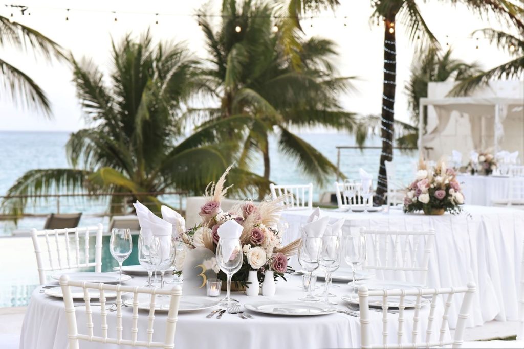 pool terrace wedding venue with ocean view at a luxury resort in the riviera maya