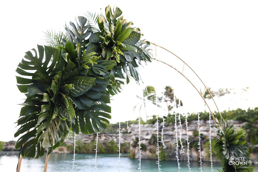 tropical wedding arch at a beach wedding venue in the riviera maya