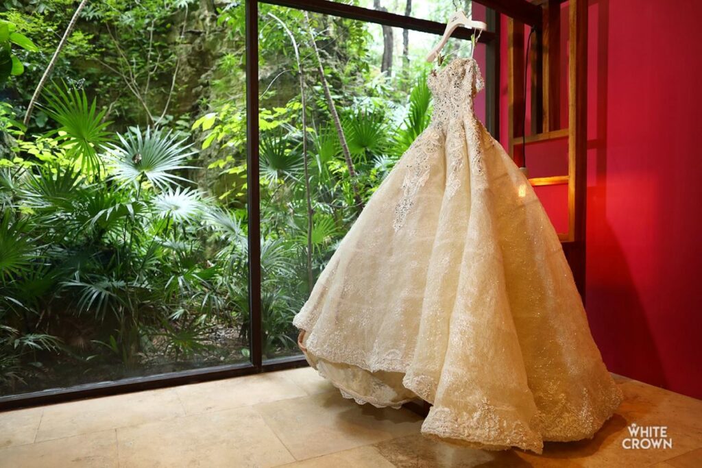 a beautiful wedding dress at the bridal suite of a luxury all inclusive resort in the riviera maya