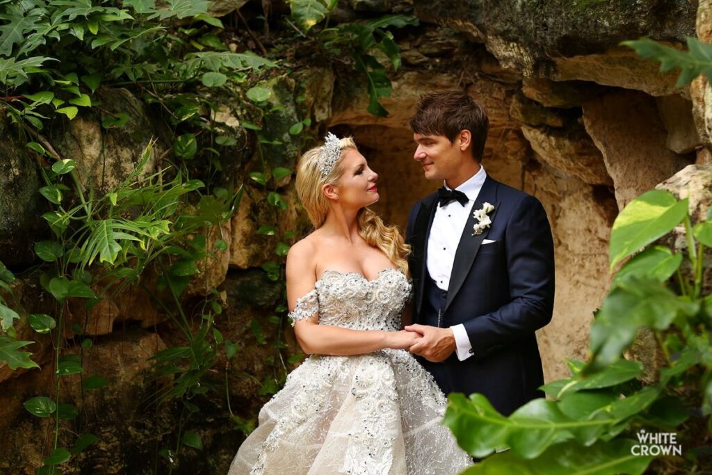 Couple posing at their wedding at hotel xcaret mexico