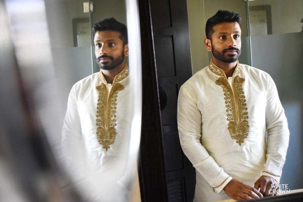 traditional groom attire for a beach wedding